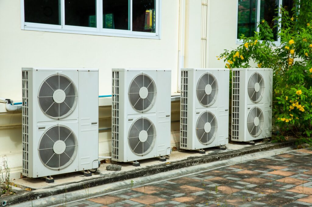 Air conditioner compressor installed in old building.